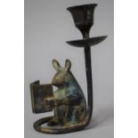 A Green Patinated Bronze Effect Novelty Candlestick in the Form of a Seated Mouse Reading a Book,