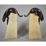A Reproduction Pair of Bronzed and Onyx Art Deco Style Bookends Modelled as Panthers Descending