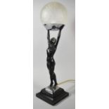 A French Art Deco Figural Table Lamp in the Form of a Nude Girl on Tiptoes Holding Globe, Chrome
