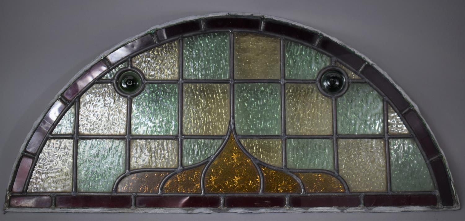 A Vintage Arched Top Stained Glass Window or Door Light, 79cm wide and 36cm high