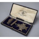 A Silver Medal from Thompson (Wolverhampton) Ltd, Awarded to "T Moxon, For Service 1906-1927" of