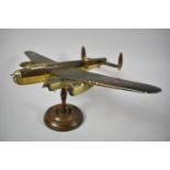 A Painted Wooden Model of a Flying Lancaster Bomber, Missing Wheels and Several Propeller Blades,