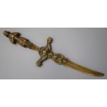 A Moulded Brass Letter Opener in the Form of a Curved Bladed Dagger with Medieval Knight Finial,