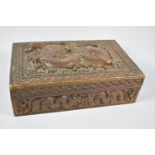 An Ornately Carved Chinese Hardwood Box, the Hinged Lid and Side Panels Decorated with Dragons, 31cm