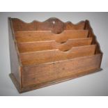 An Edwardian Oak Four Division Stationery Rack