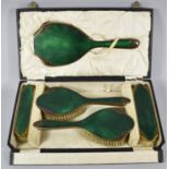 A Cased Green Enamelled and Gilt Edwardian Dressing Table Set, Comprising Hair Brushes, Clothes