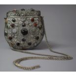 An Islamic White Metal Purse on Chain with Coloured Stone Cabochon, Shell and Bead Decoration to