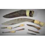 A Vintage Bone Handled Kukri Knife with leather Scabbard and Complete with Various Tools, Some