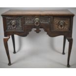 A 19th Century Oak Lowboy with Blind Carved Drawers Having Brass Lion Mask and Ring Drop Handles,