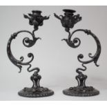 A Pair of Reproduction Pressed Metal Candle Sticks in the Form of Flowers, 27cm high