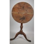 A 19th Century Oak Tripod Wine Table, Top Split and In Need of Restoration