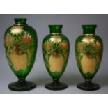 A Pair of Gilt and Green Glass Decorated Vases and a Similar Taller Example