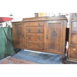 An Edwardian Oak Galleried Sideboard with Four Centre Drawers Flanked by Two Cupboards, One Drawer