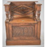 A Carved Oak Single Settle with Hinged Box Seat, 70cm wide
