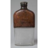An Edwardian Leather Mounted Glass Hip Flask of Large Size with Silver Plated Screw Top, 21.5cm high
