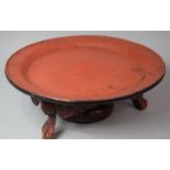 An Oriental Lacquered Lazy Susan with Three Scrolled Carved Feet, 46cm Diameter