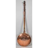 A 19th Century Copper Bed Warming Pan on Turned Wooden Handle