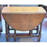 An Edwardian Oak Drop Leaf Gate Leg Barley Twist Table, 90cm long