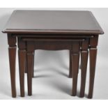 A Nest of Three Mahogany Tables by Stag, Largest 54cm wide