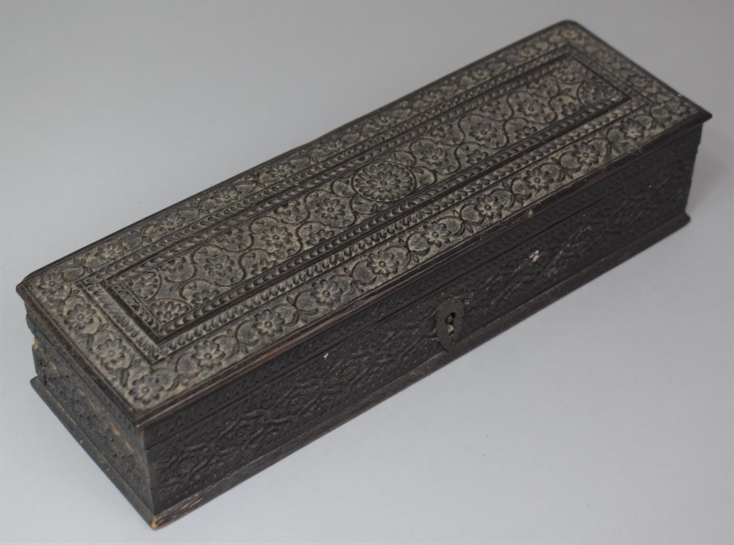 A 19th Century Intricately Carved Ebony Pen Box with Hinged Lid, 26.5cm wide