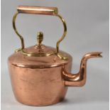 A Polished Copper and Brass Kettle with Acorn Final, 28cm high