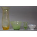 A Small Green Glass Vase, Two Glass Bowls and a Tall Amber Glass Vase