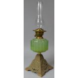 A Late Victorian Brass Based Oil Lamp with Green Glass Reservoir and Duplex Controls, 58cm high Max