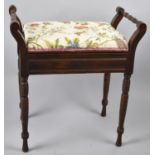 An Edwardian Mahogany Piano Stool with Turned Carrying Handles on Scrolled Supports, Upholstered