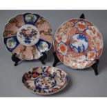 A Collection of Three Various Japanese Imari Chargers, Largest 21cm high