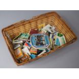 A Small Woven Basket Containing Vintage Matchbox and Matchbooks