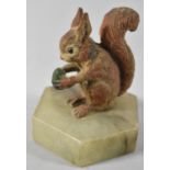 A Cold Painted Spelter Study of a Red Squirrel with Acorn on Hexagonal Onyx Base, 8.5cm High