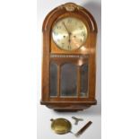 An Edwardian Oak Cased Wall Clock with Circular Dial, Pendulum Snapped, 66cm high