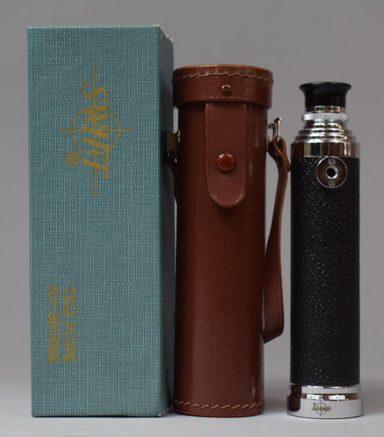 A Leather Cased Swift Three Fold Telescope in Original Cardboard Box