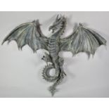 A Large Wall Hanging Reconstituted Study of a Winged Dragon, 60cm high
