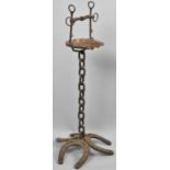 A Handcrafted Wrought Iron and Copper Smokers Stand on an Equine Theme with Tripod Horseshoe Base,