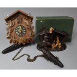 A Mid 20th Century Cuckoo Clock (Hands with Loss) and Boxed Black Forest Crib, "Stille Nacht Heilige