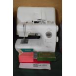 A Janome My XL 4023 Sewing Machine with Instruction Book Together with Two Boxes Containing