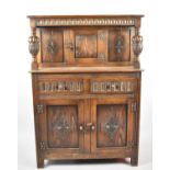 A Mid 20th Century Oak Court Cupboard of Small Proportions Having Two Drawers and Carved Panel Doors