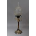 A Late Victorian/Edwardian Table Top Oil Lamp with Cut Glass Reservoir, Low Chimney on Circular