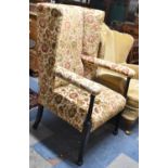 An Edwardian Tapestry Upholstered Porters Wing Armchair