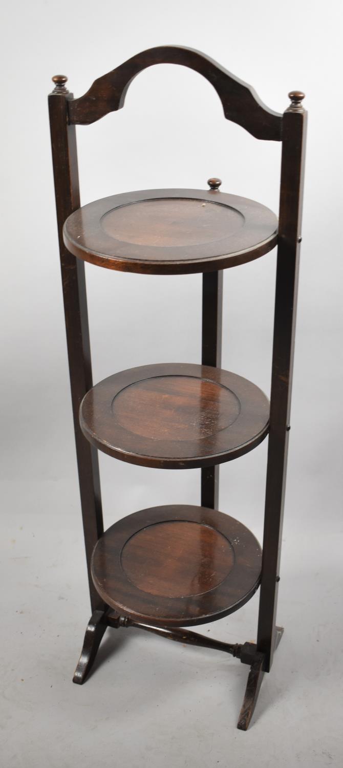 An Edwardian Rosewood Three Tier Cake Stand with Hinged Mechanism, 89cm High