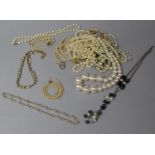 A Collection of Various Pearl and Faux Pearl Necklaces