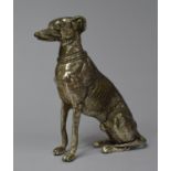 A Mid 20th Century Silver Plated Study of a Seated Greyhound, 15cm high
