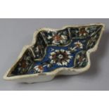 A Shaped Eastern European Glazed Dish with Floral Decoration, 21cm wide