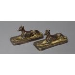 A Pair of Silver Plated Mounts in the Form of Reclining Greyhounds on Rectangular Bases, Each 9cm