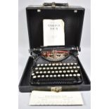 A Vintage Cased American Portable Typewriter, The Corona IV, with Instruction Manual and Chart