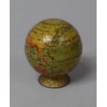 A Small Novelty Pencil Sharpener in the Form of a Globe, 5cm high