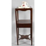 A 19th Century Mahogany Gentleman's Washstand with Centre Drawer and Shaped Stretcher Wash Jug
