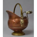 A Reproduction Brass and Copper Novelty Bowl in the Form of a Helmet Shaped Coal Scuttle with