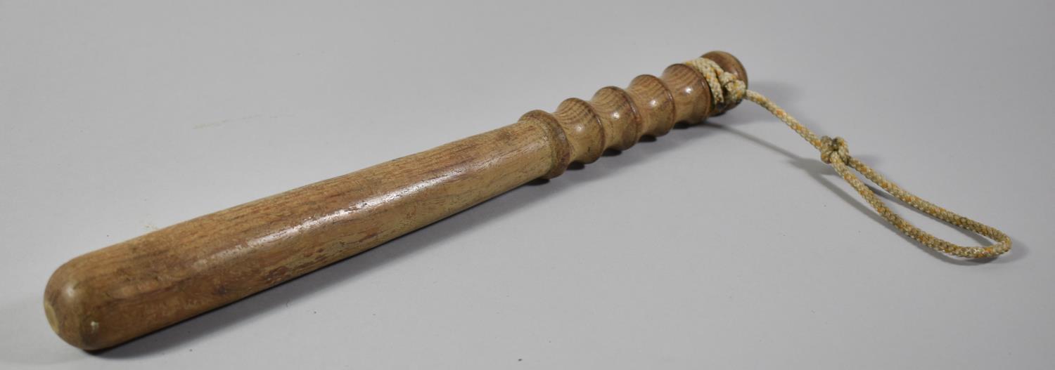 A Modern Turned Wooden Truncheon with Rope Lanyard, 39cm Long